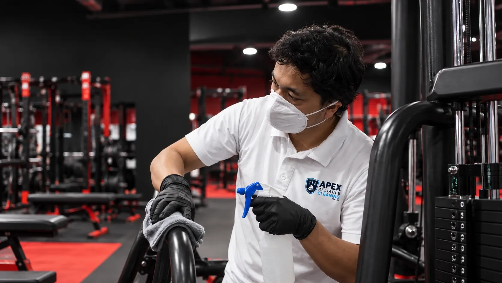 Staff cleaning bike at UFC Gym