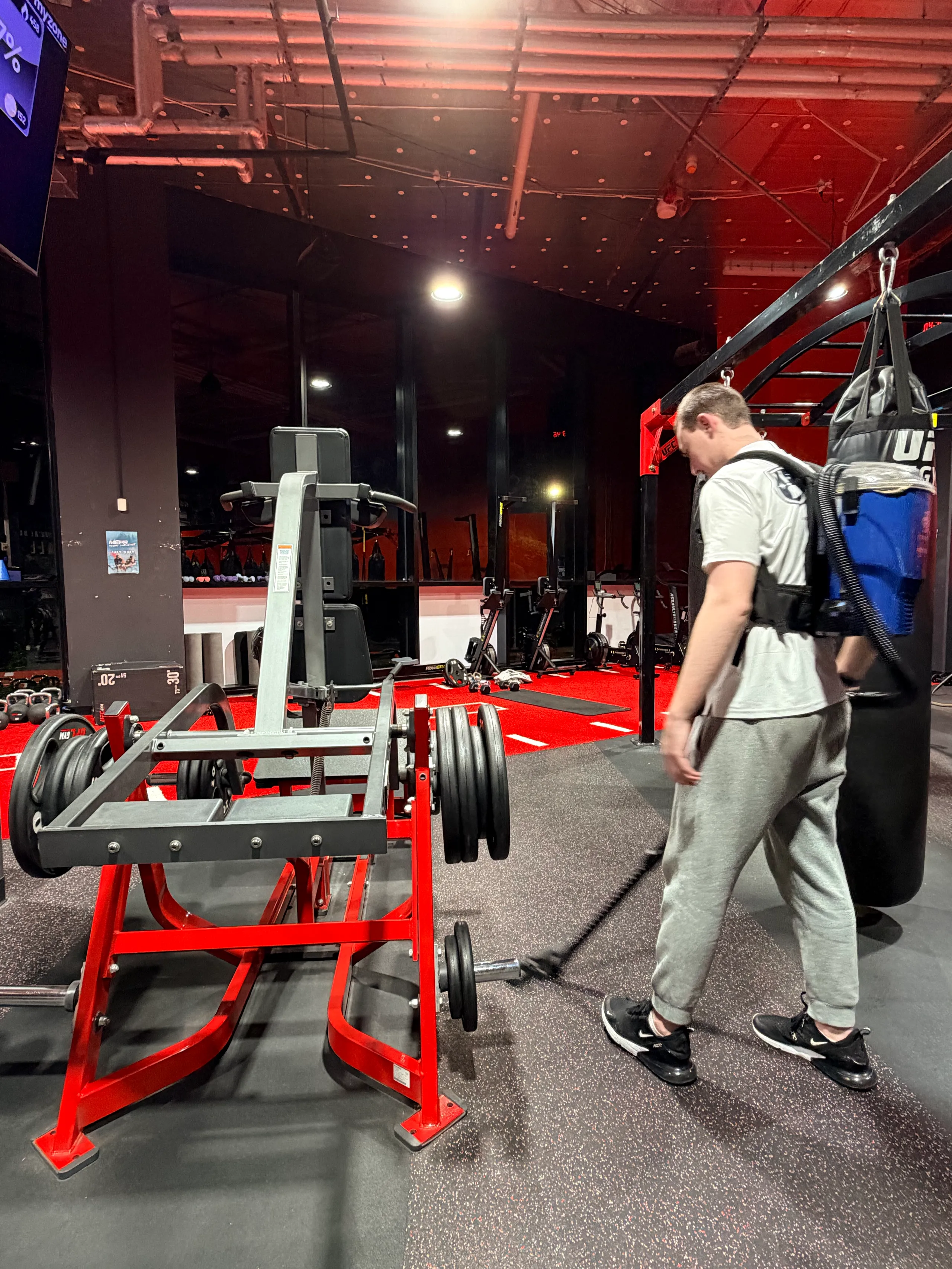 Wide-angle CBD gym with architectural glass ceiling