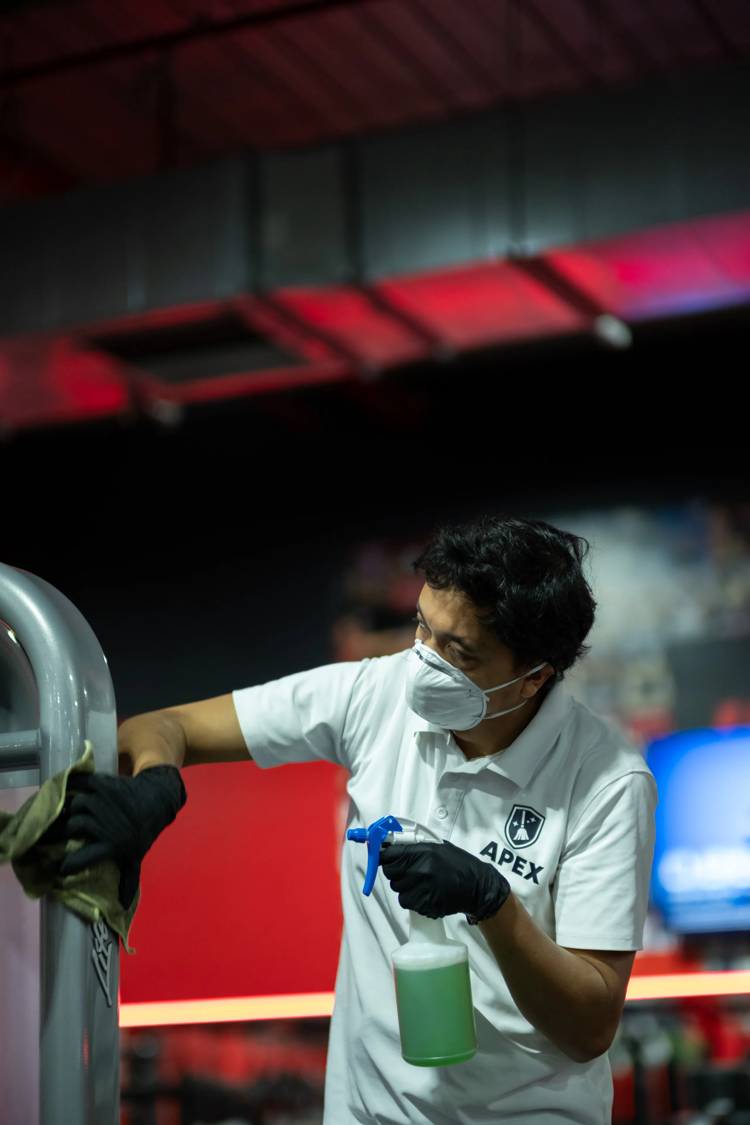 Staff cleaning bike at UFC Gym